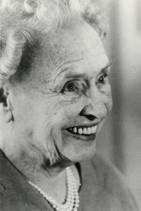 Helen Keller, beaming, at 80 years old