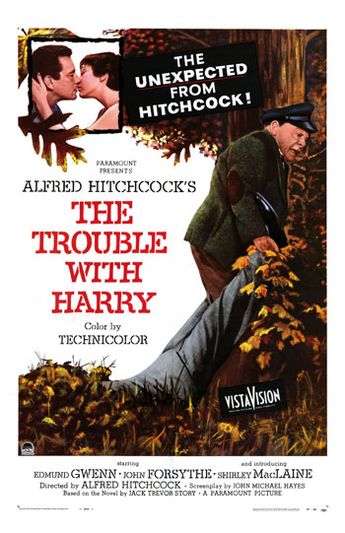 Movie poster for The Trouble With Harry - in the upper left corner a man and woman kiss, while in the foreground an older man drags a business-suit-clad body through the autumn leaves