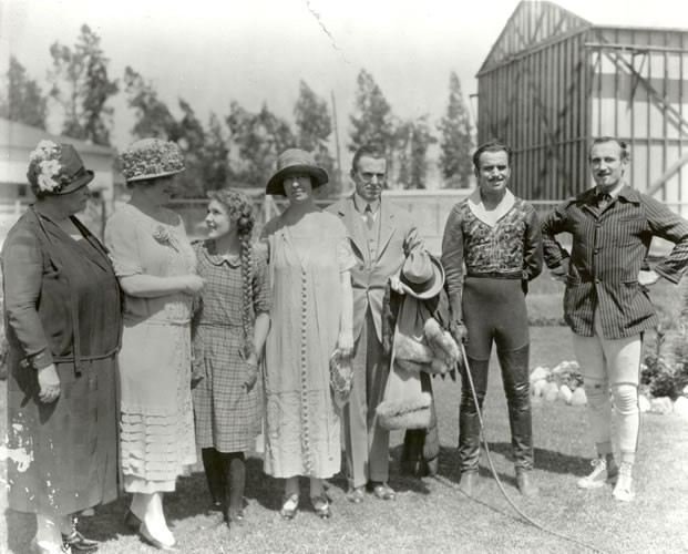 Photograph of (left to right) Anne Sullivan Macy, Helen Keller, Mary Pickford, Polly Thomson, Charles B. Hayes, Douglas Fairbanks and an unidentified man, circa 1925 in Hollywood, California.