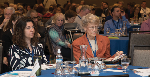 Two AFBLC19 attendees seated at a table