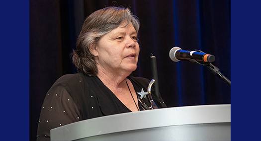 Anita Shafer Aaron accepts the Stephen Garff Marriott Award