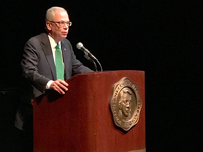 Jerome Gilbert, President of Marshall University standing at lectern speaking.