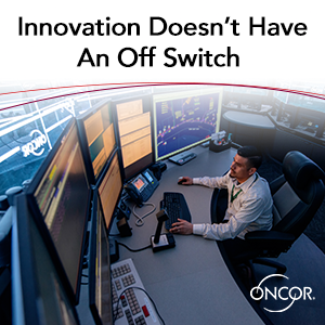 Text: Innovation Doesn't have an off switch. Image of man sitting at a computer terminal.