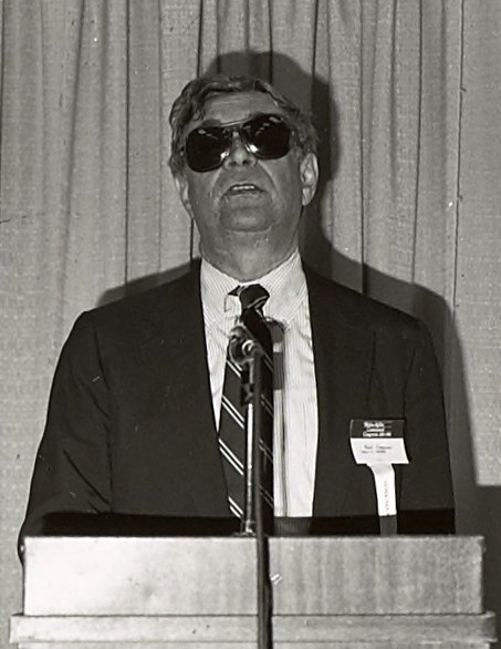 Donald Wedewer speaking from a lectern at the Helen Keller Centennial Congress in Boston, MA, 1980. Courtesy, Helen Keller Archive.