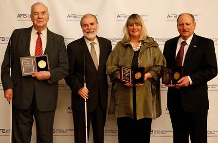 Oral Miller, Carl Augusto, Keller Johnson-Thompson, and James Kesteloot with the Migel medals