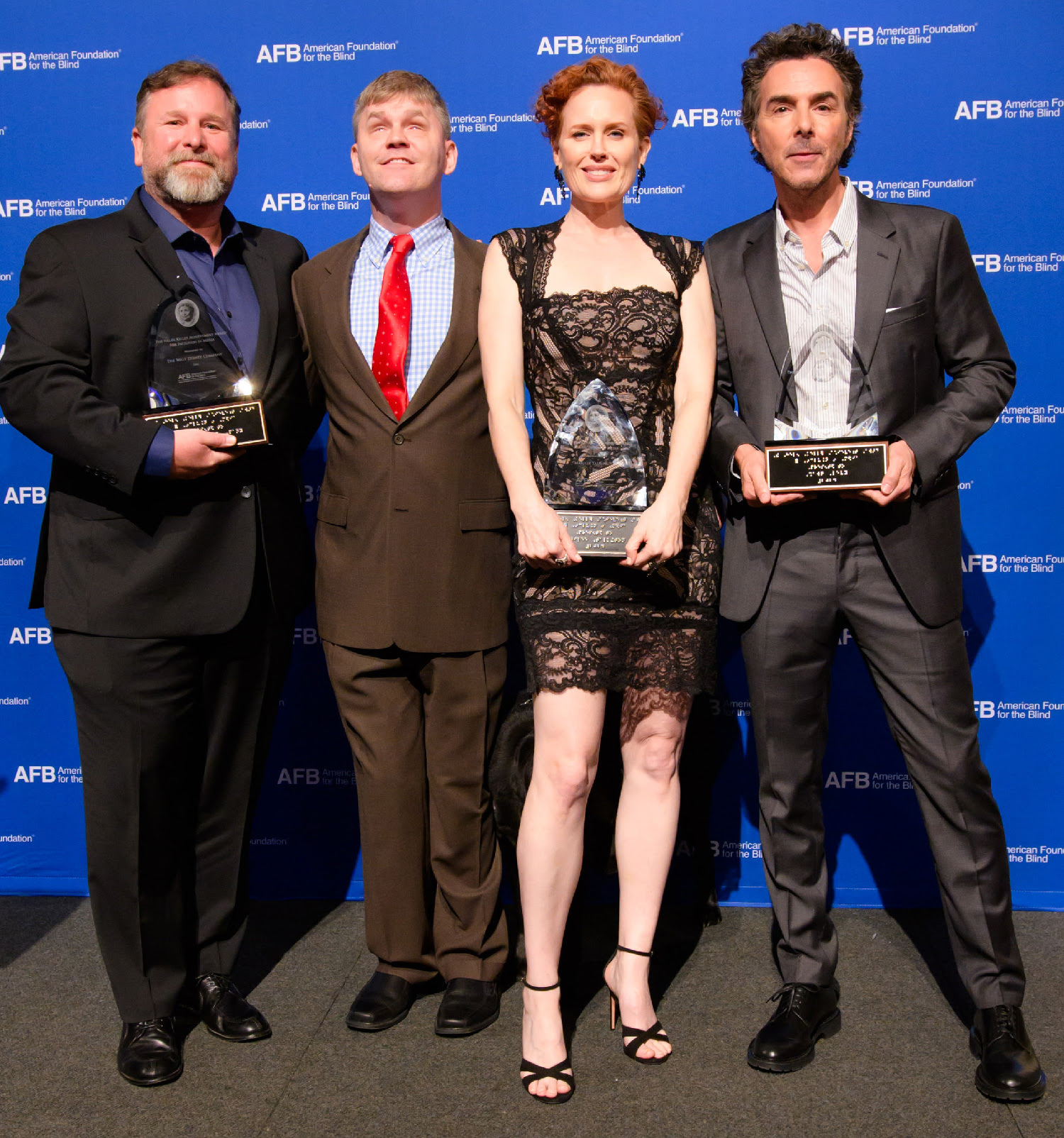 From left to right: Michael Kohn, Eric Bridges, Marilee Talkington, and Shawn Levy. Honorees hold their trophies with a smile.