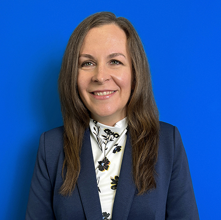 Stephanie Enyart, a smiling woman with long brown hair. 