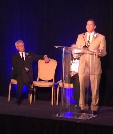 David Paterson gives a speech during the 2014 HKAA as Alex Trebek looks on