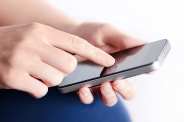 closeup of hands touching a phone screen