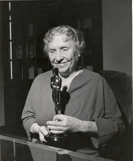 Helen Keller holding an Oscar, 1956