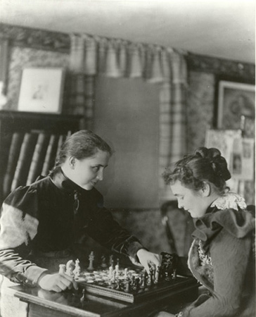 Helen Keller and Anne Sullivan playing chess