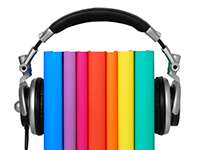 colorful array of books set between a pair of headphones