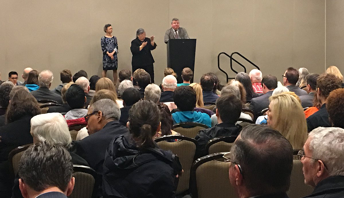 Mark Richert and Barbara Raimondo present information on the bill, with a sign language interpreter, at Cogswell-Macy Act Hill Day in Washington, D.C.