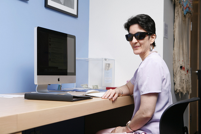 Woman sitting at desk working at her computer.