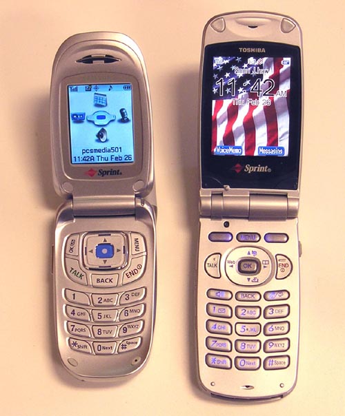 Photograph of two clam-shell style cell phones, flipped open.