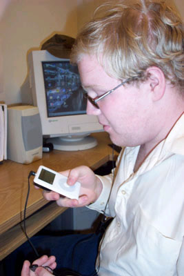 Photo of a young man with an iPod.