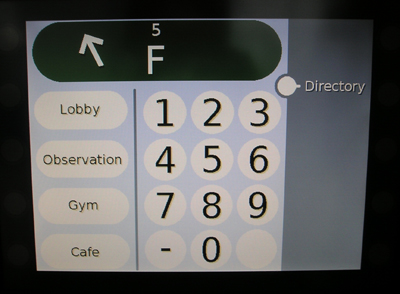 Photo of a touch screen with the display window showing an arrow pointing to approximately 11 o'clock followed by a large letter F with a small number 5 positioned directly above it.