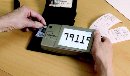 The Nemo being used to read the numbers on a credit card.