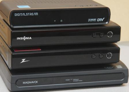 The four digital converter boxes stacked with the smallest, the Digital Stream, on top.