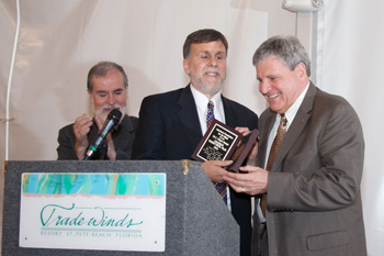 Photo of Dr. Kerscher receiving Migel Medal from Paul Schroeder