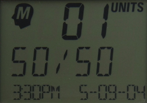 An image of a blood glucose monitor screen displaying text and numbers. The display is monochrome, and the letters are slightly blocky.