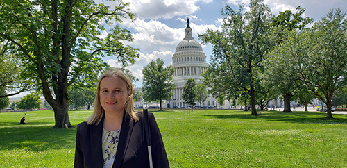 Stacy Cervenka, Director Public Policy. In the background the US Capitol Building can be seen